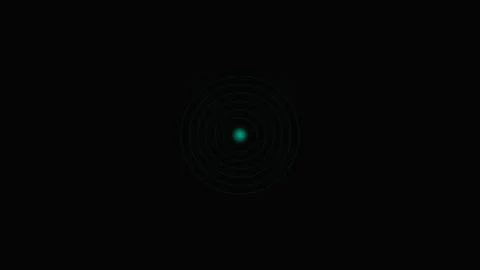 A glowing cyan circular light pattern emerging from a deep black background Stock Footage 339619227