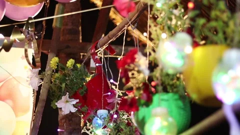 Glowing Decorative Bulb and Flower Pot at Festive Birthday Celebration Stock Footage 334774535