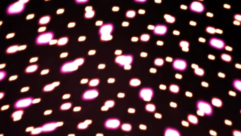 Glowing dots on black background with vibrant pink and yellow lights. Stock Footage 335516732