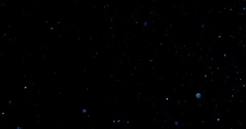 Glowing dust particles on black overlay. Glitter bokeh particles. Stock Footage 255042450