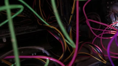 Glowing EL wire sorrounded by cables and computer parts 動画素材 84292328