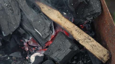 Glowing embers with dancing ash. Serene charcoal fire with swirling dust Stock Footage 341662799
