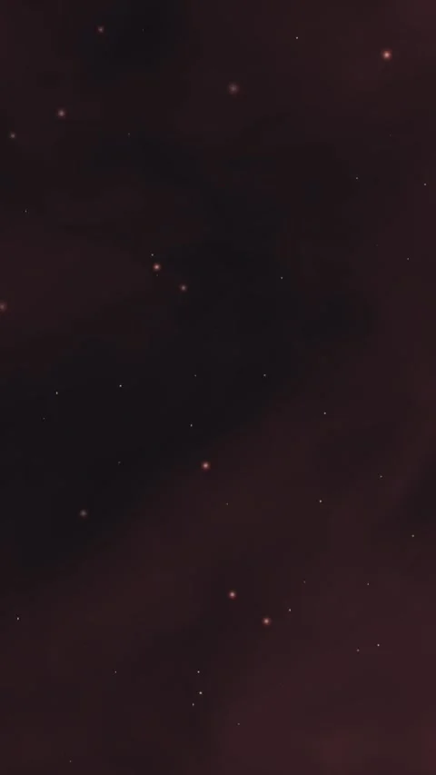 Glowing embers drift upward through a dark, reddish-brown cosmic void 库存影片 345187611