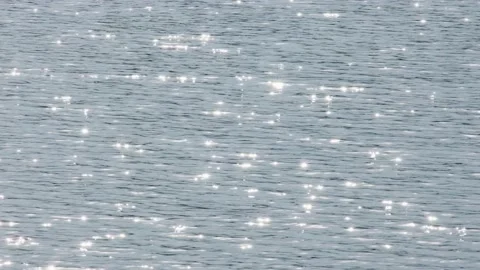 Glowing endless calm water surface ripple smooth pond sea river ocean. Bright Stock Footage 167977830