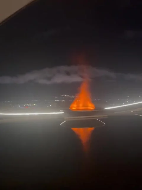 Glowing Fire Installation Over Water at Night Stock Footage 341317466