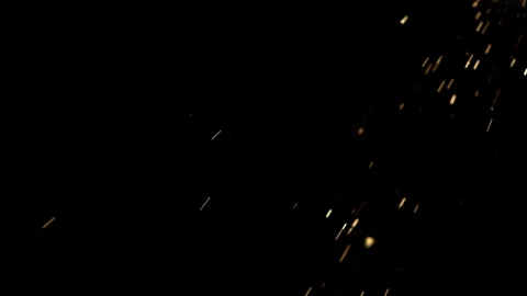 Glowing fire sparks fall through dark air Stock Footage 327123478