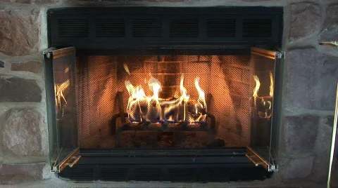 Glowing fire in a stone fireplace Stock-Footage 98203