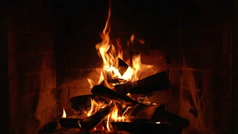 A Glowing Fire in the Stone Fireplace Warm Cozy Fireplace with Real Wood Burning Stock-Footage 171787510