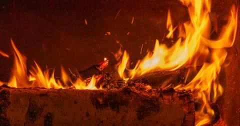 A glowing fire in the stone fireplace to warm a chilly night. With copy space Foto stock