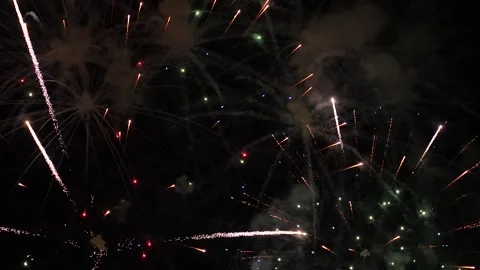 Glowing firework patterns performance in dark night sky on holiday event Video stock 260645187