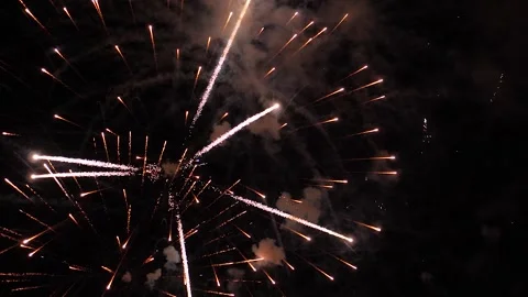 Glowing firework patterns performance in dark night sky on holiday event Video stock 265844161