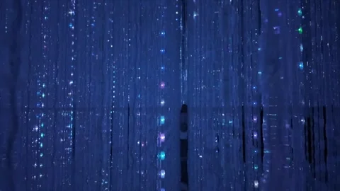 Glowing glass beads hanging from ceiling with mesmerizing light reflections Stock Footage 336278933