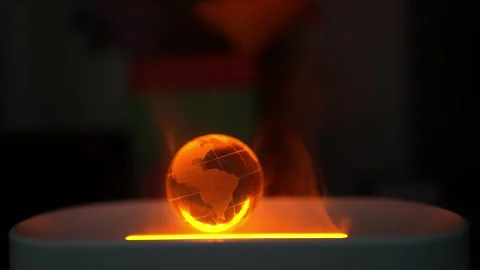 Glowing Globe with South America Map and Smoke, A glowing orange globe with.. Vídeos de archivo 304875990