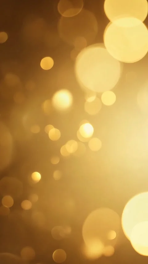 A glowing golden bokeh background, creating a festive and luxurious visual Stock Footage 310295924