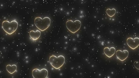 Glowing golden heart outlines float gently against a dark starry background 库存影片 340941713