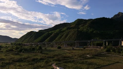 Glowing golden hour over remote tropical hills Stock Footage 336610320