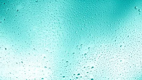 Glowing gradient turquoise background with contrasting water drops Stock Photos