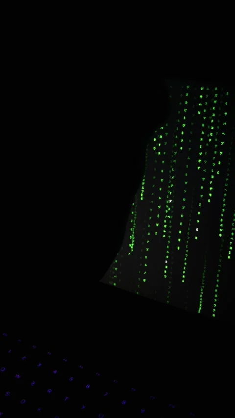 Glowing Green Digital Rain Falling Behind Purple Backlit Keyboard Stockbeeldmateriaal 334733880