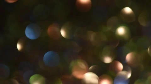 Glowing green orb floating in dark liquid. Mysterious neon bubble rising in blac Stock Footage 340450342