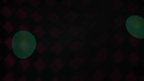 Glowing green orbs on dark background with red diamond pattern. Stockbeeldmateriaal 337510417