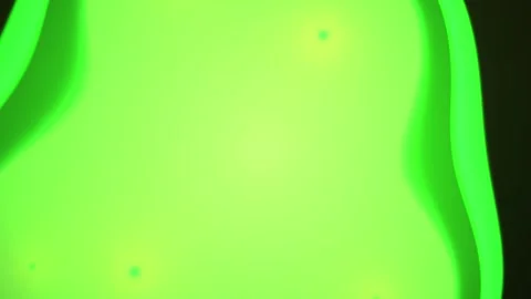Glowing green plastic object closeup. Stock Footage 334684256