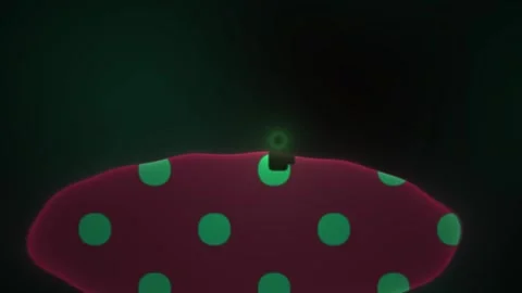 Glowing green polka dots on a red oval object. Stock Footage 337466336