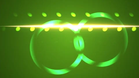 Glowing green rings with light beams and dots on dark background. Stock Footage 335520920