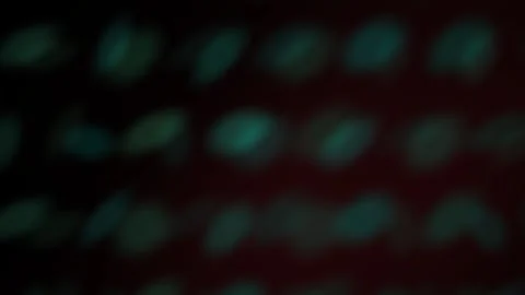 Glowing green spots on dark background. Stock Footage 340023554