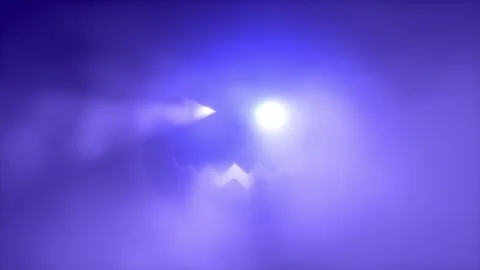 Glowing Halloween jack-o-lantern face in colorful fog with falling autumn leaves Stock Footage 345551122