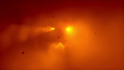 Glowing Halloween jack-o-lantern face in orange red fog with falling autumn leav Stock Footage 345551137