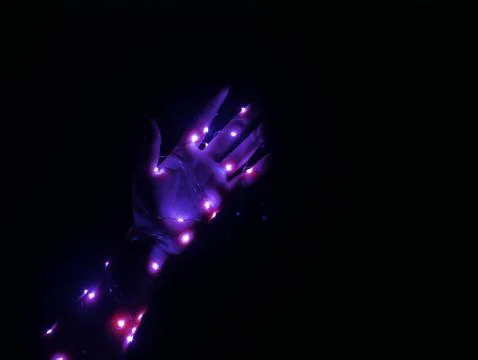 A glowing hand in the dark -3 Stock Photos