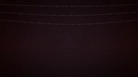 Glowing Hanging String Lights Animation on Dark Background 스톡 동영상 347966994