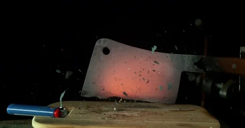 Glowing Hatchet Chops onto Lighter Stock Footage 77782471