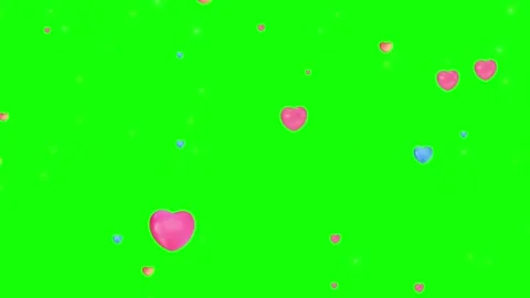 Glowing heart shape made of golden particles. Romantic love overlay on green Video stock 340944219