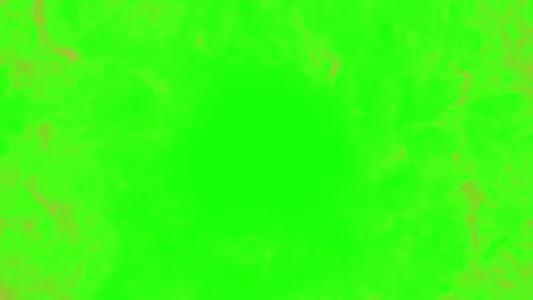 Glowing heart shape made of golden sparkles. Romantic fire particles on green Video stock 341304661