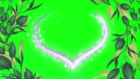 Glowing heart shape with magical sparkles and green leaves frame on green Stock Footage 344927942