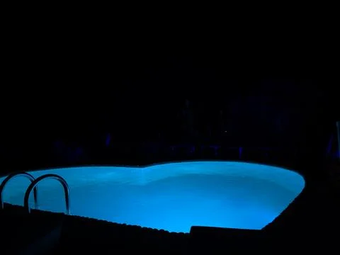 Glowing Heart-Shaped Pool Under Night Sky Stock Photos