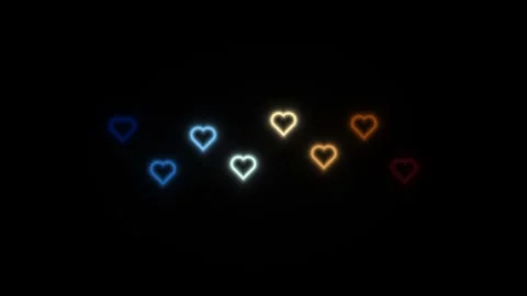 Glowing hearts in different colors on a dark background Video stock 338227534