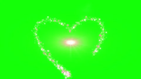 Glowing hearts made of sparkling particles on green background 스톡 동영상 338216877