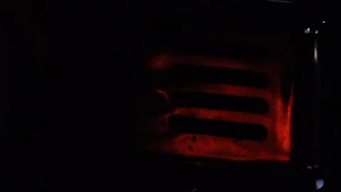 Glowing heater element in darkness Stock Footage 336532224