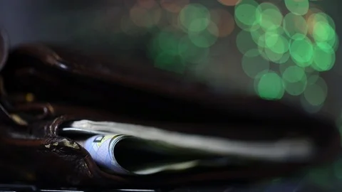 Glowing high speed internet optical fibres, opened wallet on computer keyboard Stock Footage 112341086