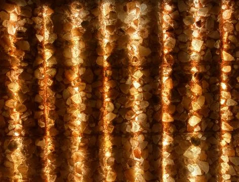 Glowing Himalayan salt wall texture background with warm illuminated pattern Stock Photos