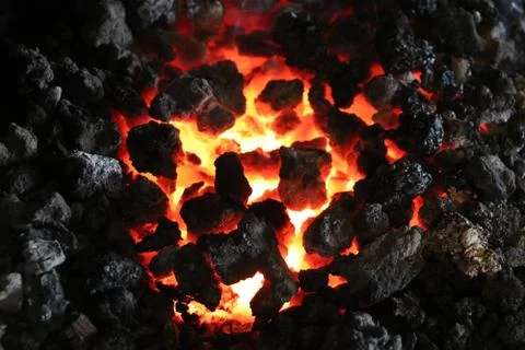 Glowing Hot Coals in Active Fire Stock Photos