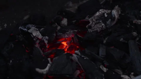 Glowing hot ember between charcoal. Stock Footage 276227701