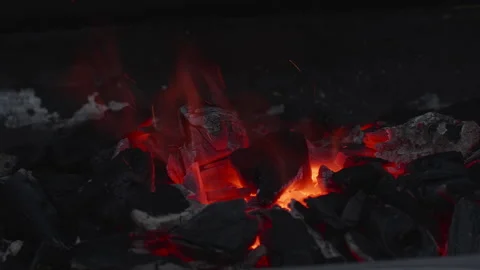 Glowing hot ember between charcoal. Stock Footage 276227734