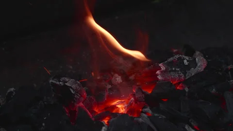 Glowing hot ember between charcoal. Video stock 276227835
