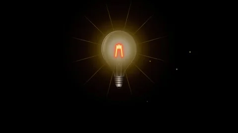 Glowing incandescent light bulb radiating warm yellow light against a dark .. 動画素材 335826318