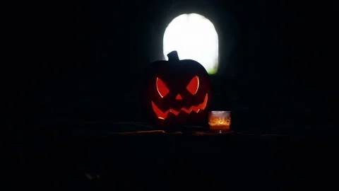 Glowing Jack O Lantern And Candle Inside Dark Tunnel With Bright Light at Tunnel Stock Footage 337103845