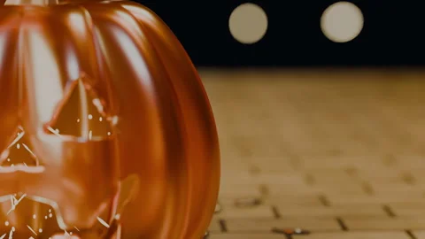 Glowing jack-o'-lantern face on polished golden cobblestones, 4K Stock Footage 346121018