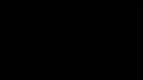 Glowing jack-o-lantern flickers in darkness with inner light Stock Footage 317383244